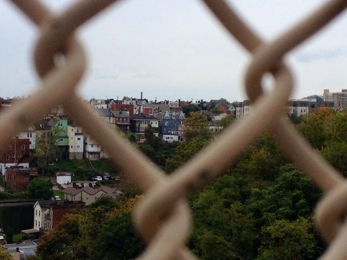 Pittsburgh Neighborhood behind a chainlink fence. 